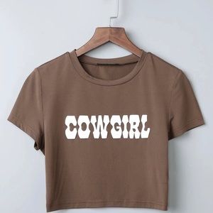 Tight crop top titled “COWBOY”